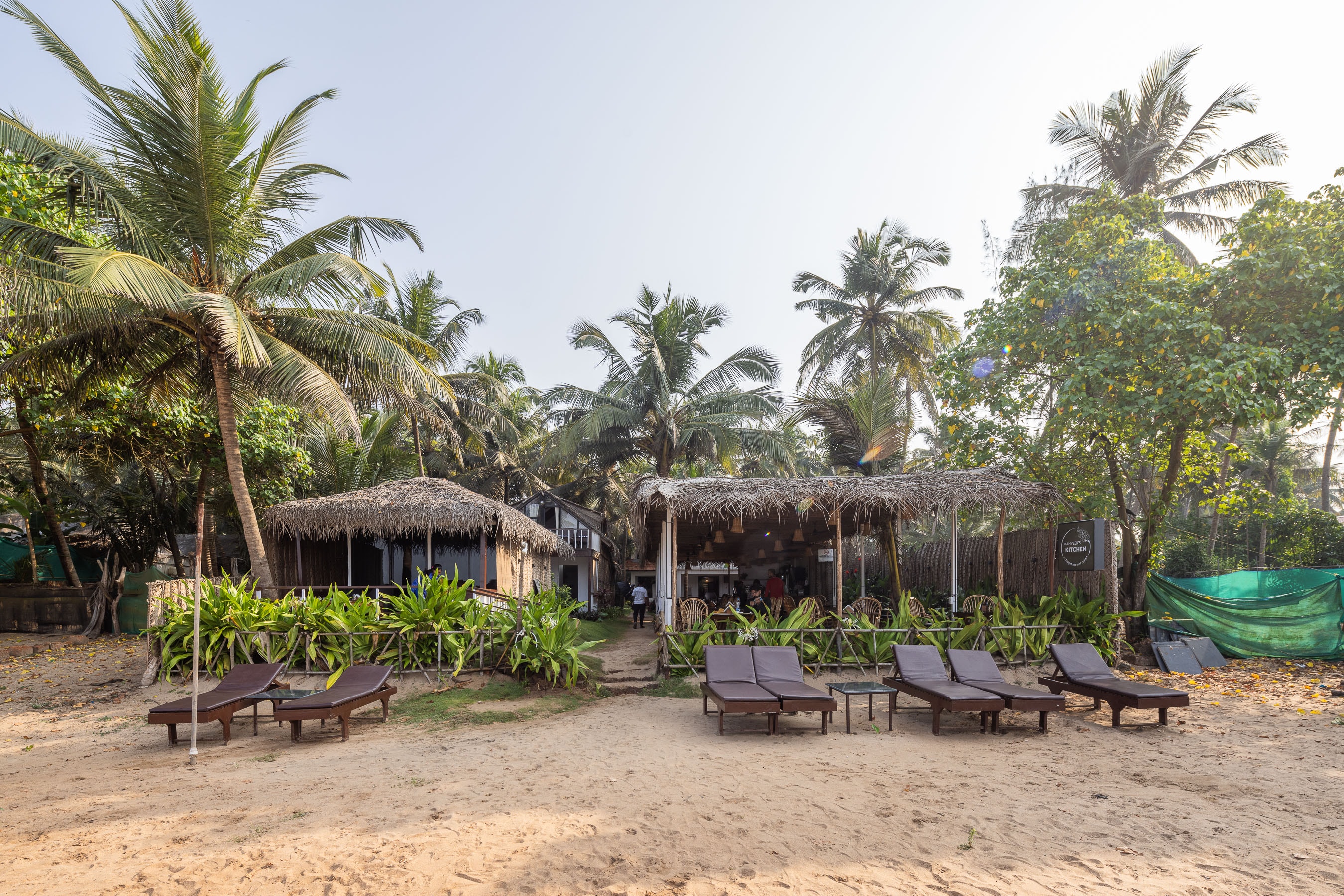 Manveer's Kitchen thatched restaurant with sun loungers on Agonda beach