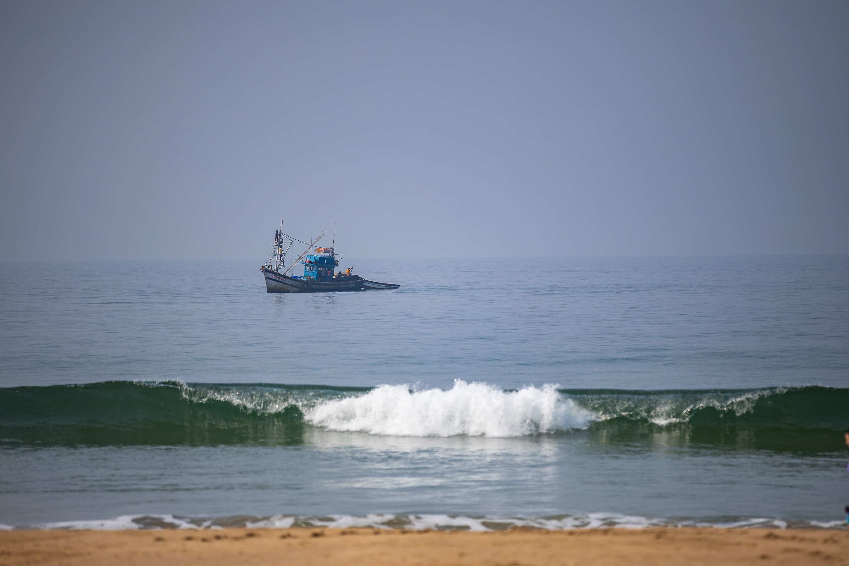 Fishing boat on the Arabian Sea at Agonda beach, South Goa
